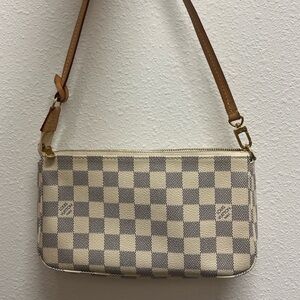 Louis Vuitton Beige and Gray Checkered Wristlet
Excellent condition!!